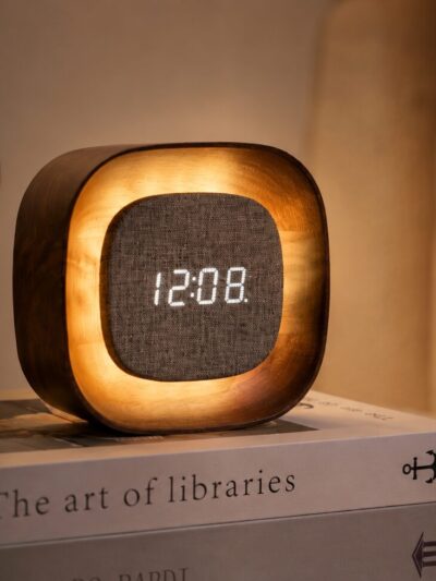 Dark walnut alarm clock. floating display with soft glowing light.