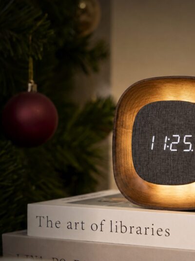 Dark walnut alarm clock. floating display with soft glowing light.