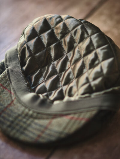 Quilted inner lining of a traditional green flat cap