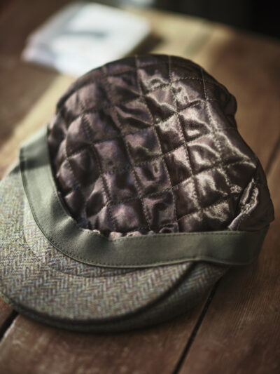 Quilted inner lining of a traditional green flat cap