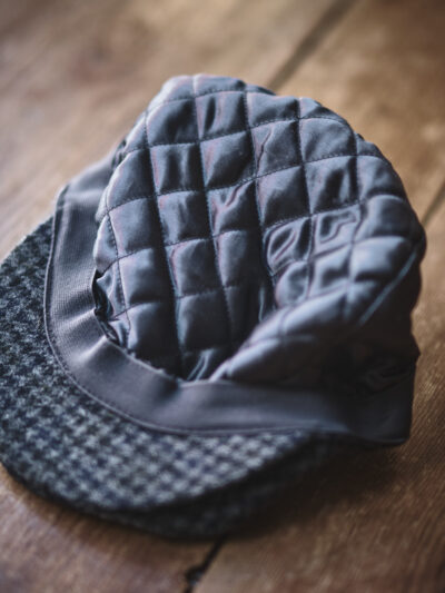 Quilted inner lining of a traditional grey flat cap