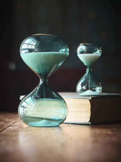 Modern contemporary sand timer hourglass in green glass
