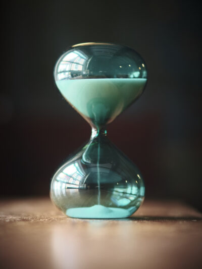 Modern contemporary sand timer hourglass in green glass