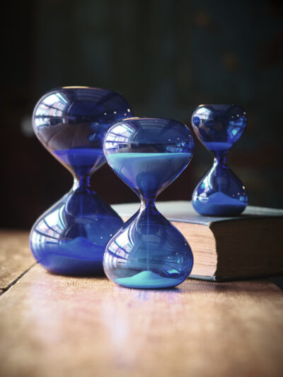 Modern contemporary sand timer hourglass in blue glass