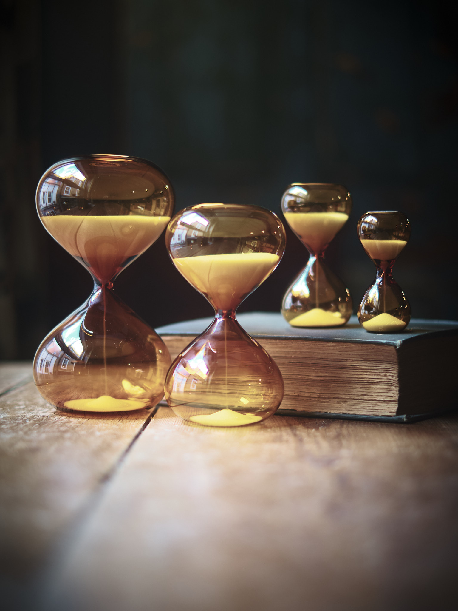 Modern contemporary sand timer hourglass in orange glass