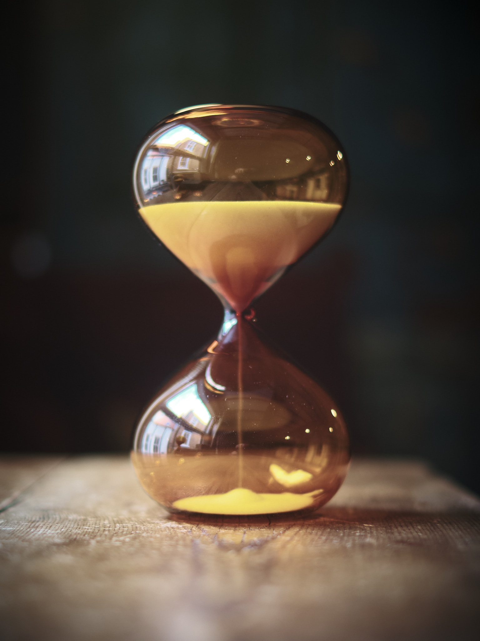 Modern contemporary sand timer hourglass in orange glass