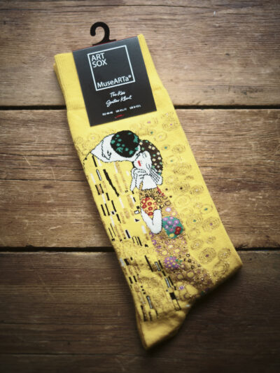Yellow socks featuring artwork of The Kiss by Gustav Klimt
